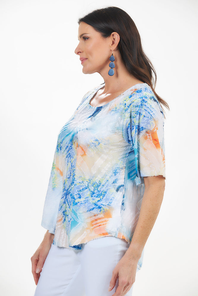 Side view of short sleeve textured tunic. Blue print short sleeve. 