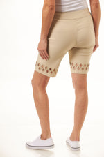 Back image of Lulu B bermuda shorts with diamond cutout detail. Stone color pullon shorts. 