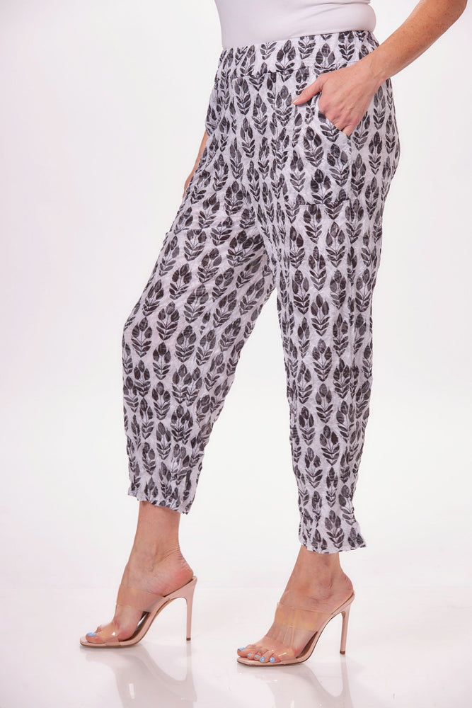 Side image of Shana pull on straight leg pant. Pull on pant black and white print. 